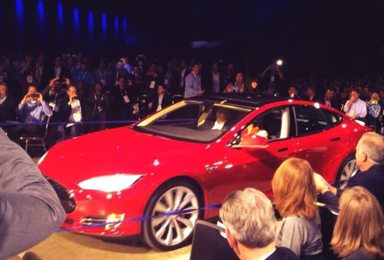 Elon Musk arrived at the Dell World stage in a Tesla automobile